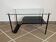 Metal and glass coffee table with magazine rack by Roche Bobois from the 1950s.