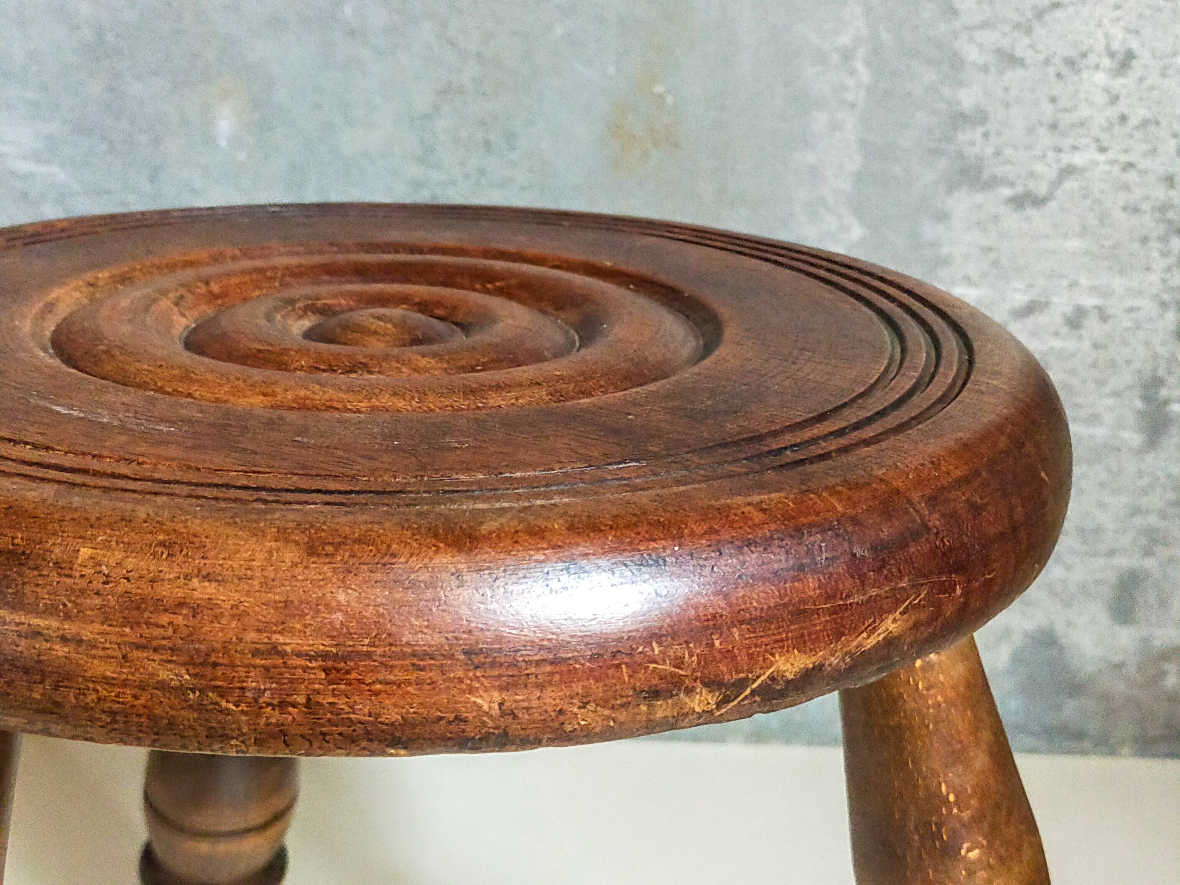 Low tripod stool in vintage turned solid wood
