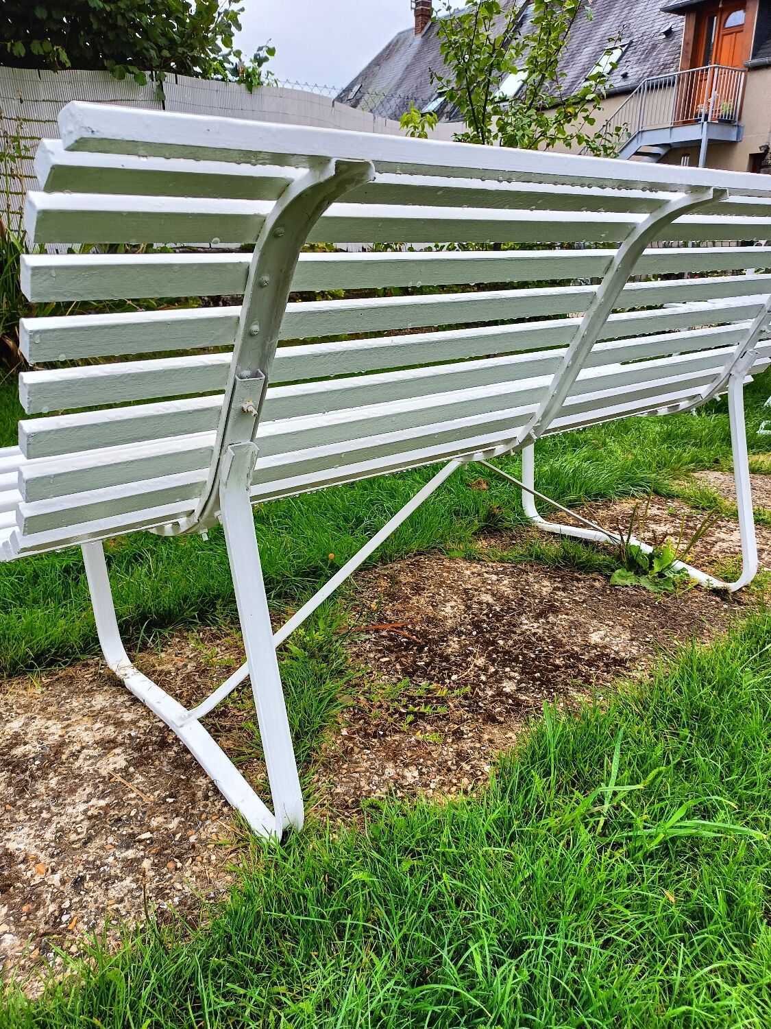 Antique garden bench with metal legs