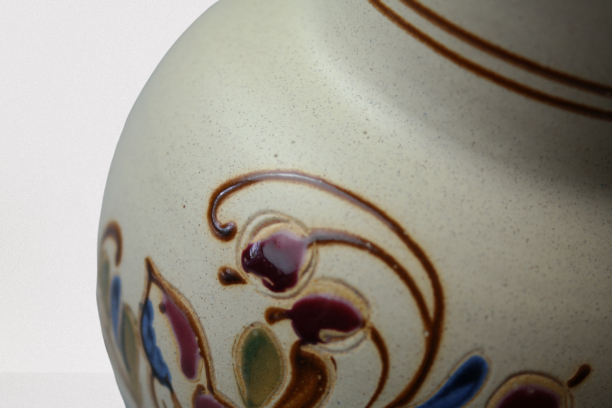 Vintage ceramic vase with bird decoration, signed.