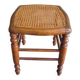 Antique wooden stool with cane seat.