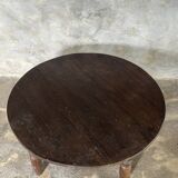 Coffee table, round antique Indonesian teak table with straight legs.