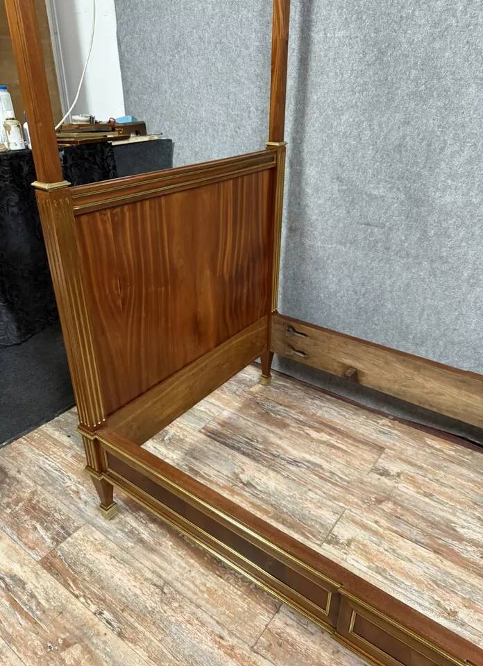 Parisian Louis XVI style four-poster bed in mahogany and gilded bronze circa 1850