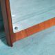 Minimalist Scandinavian mirror in teak with a vintage design.