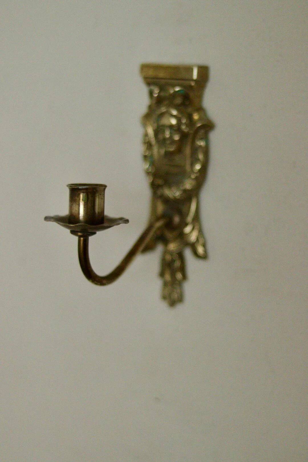 Pair of mid-century Swedish brass face motif sconces
