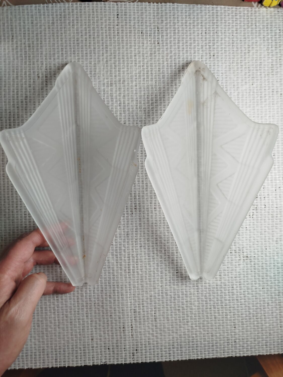 Pair of Art Deco wall sconces in frosted pressed glass.