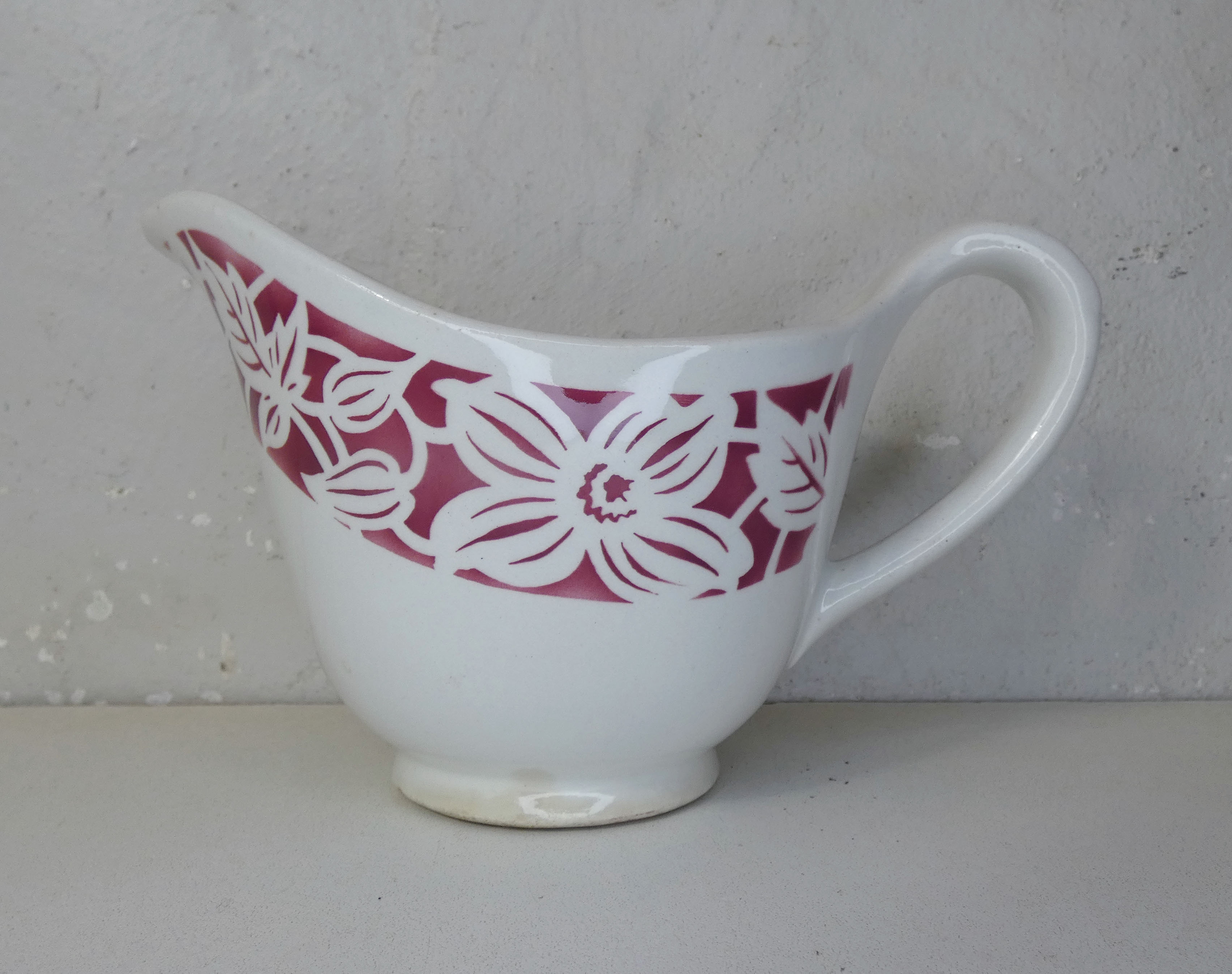 Old creamer milk pot in earthenware of Lunéville