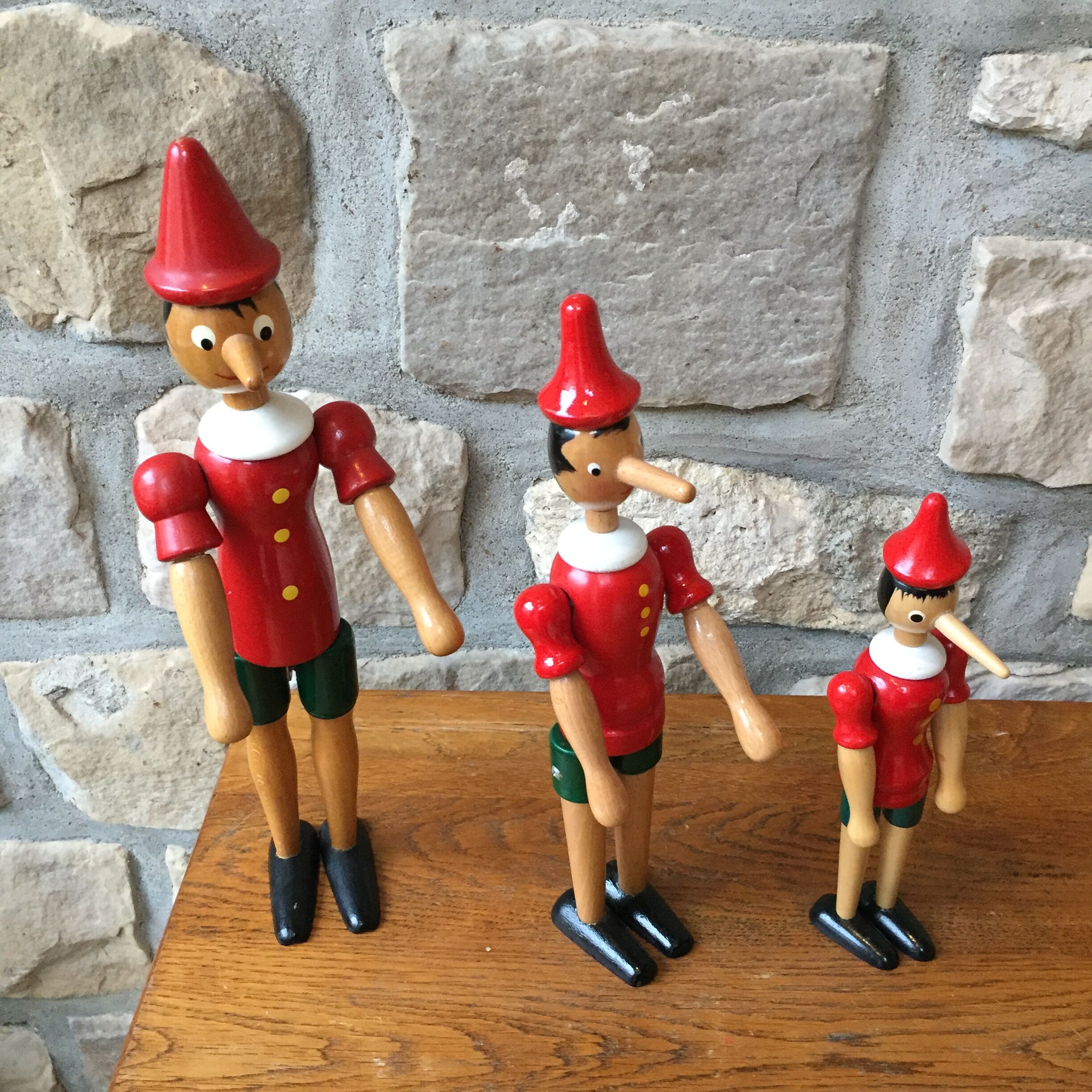 Trio of old wooden Pinocchio Made in Italy