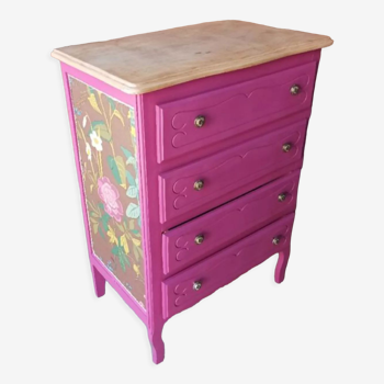 Pink chest of drawers and floral scandinavian tapestry