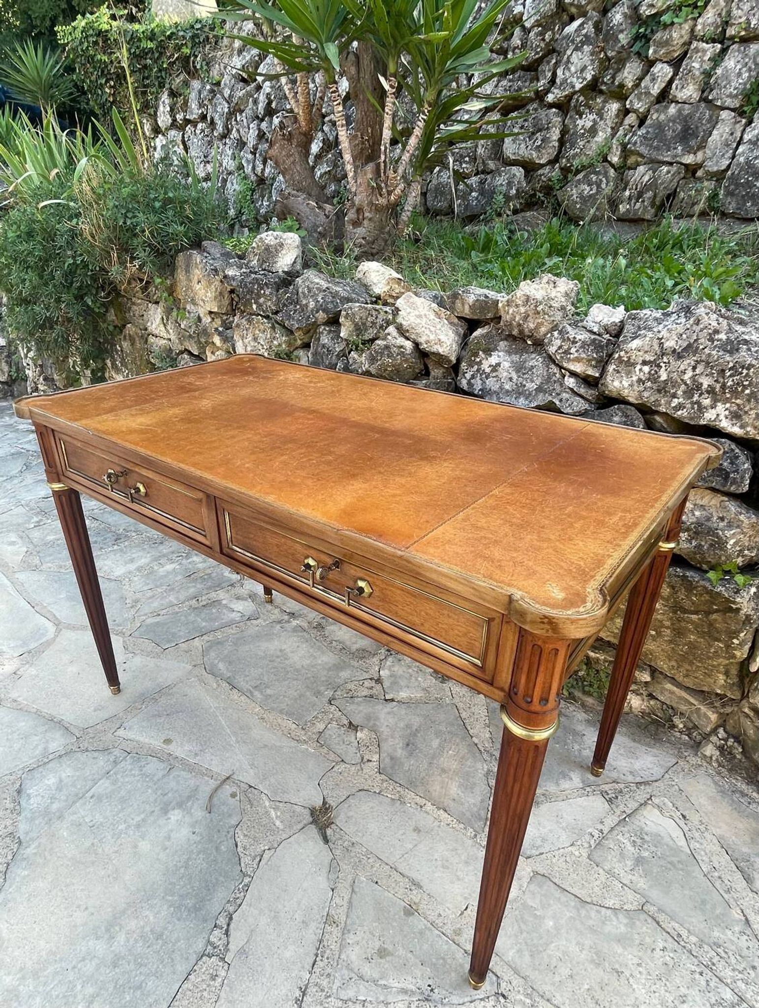 Louis XVI style mahogany flat desk from the late 19th century