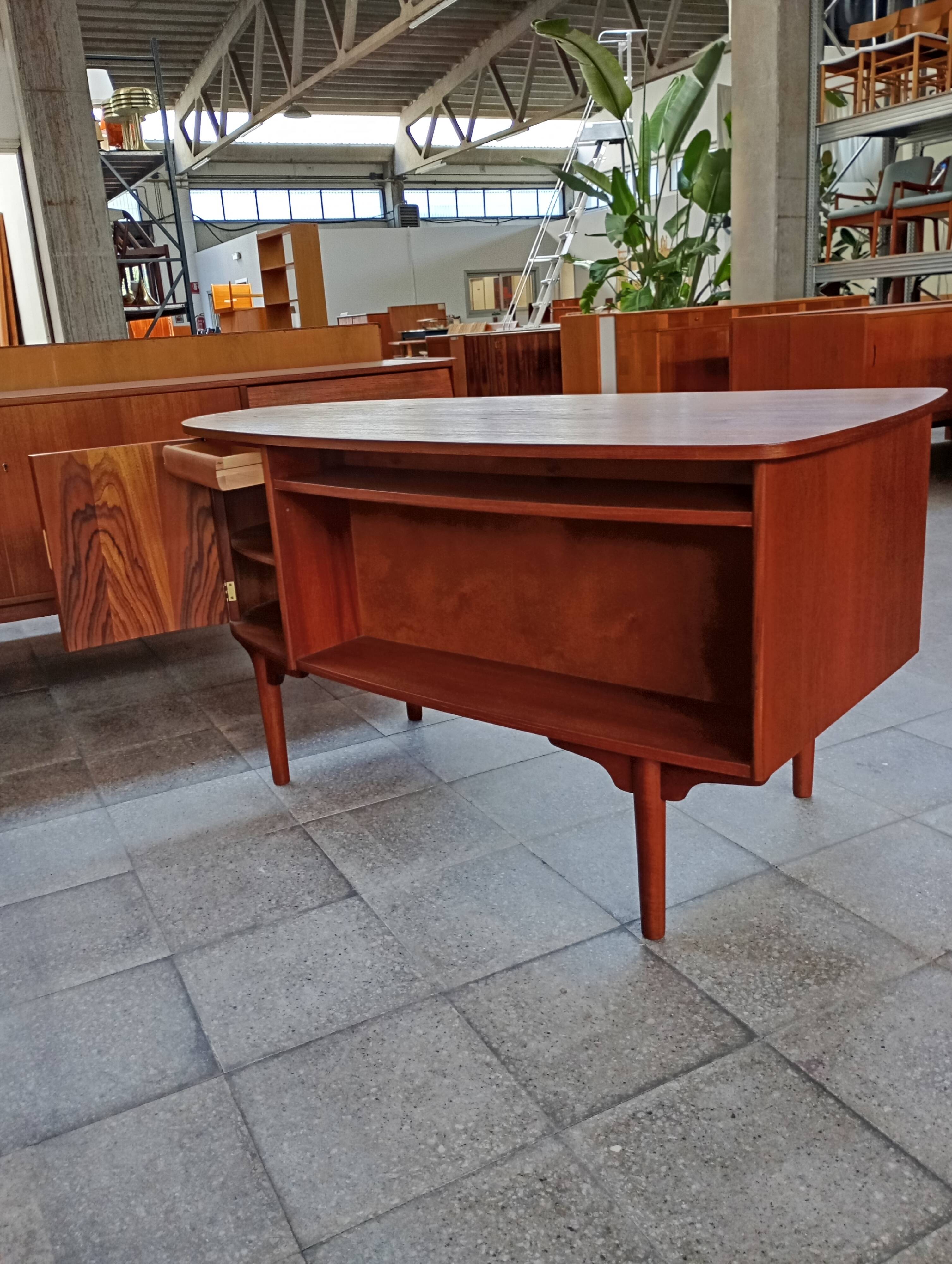 Scandinavian oval desk in teak from the 1960s.
