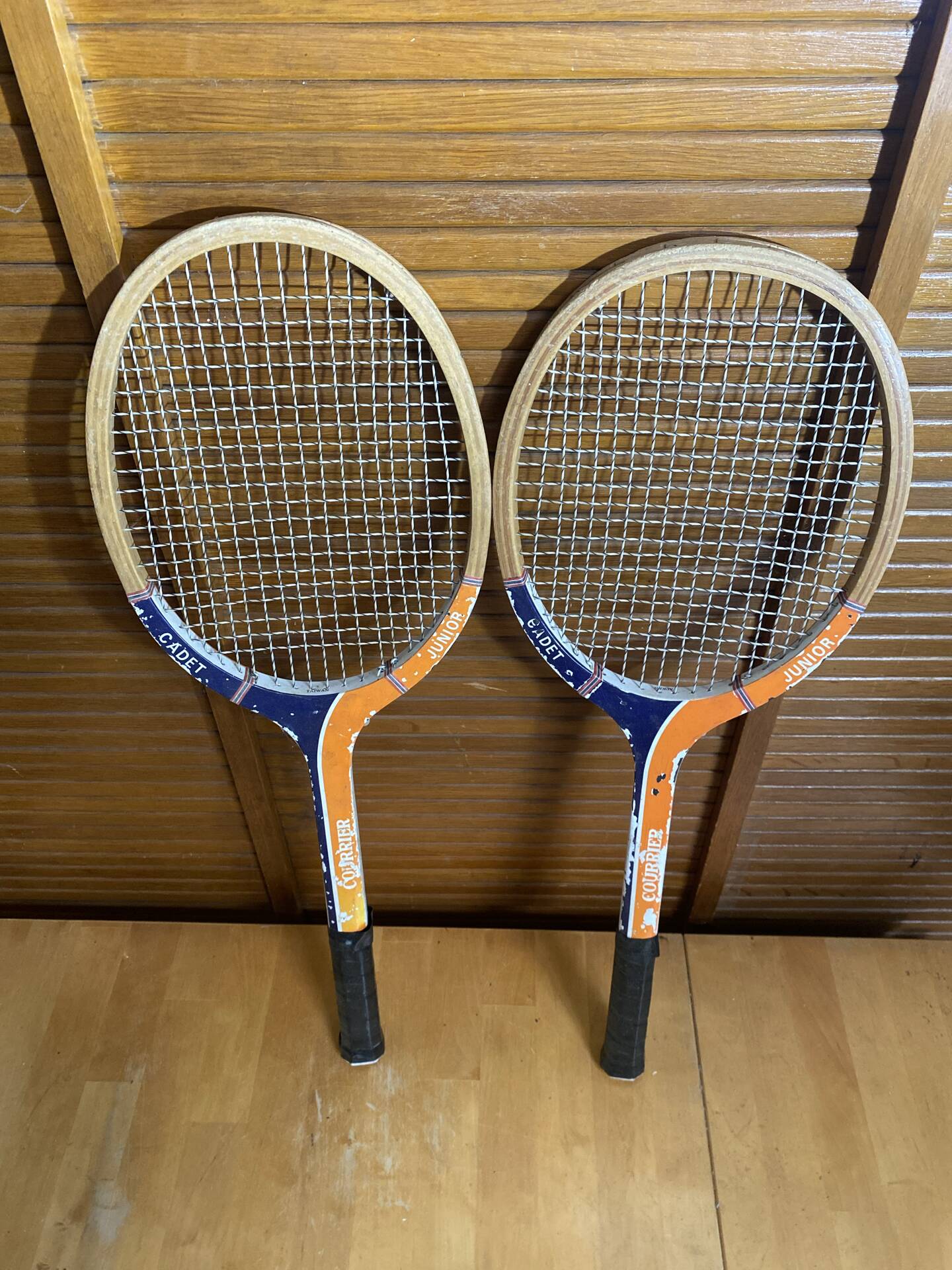 Pair of vintage wooden tennis rackets for cadet junior sport courier