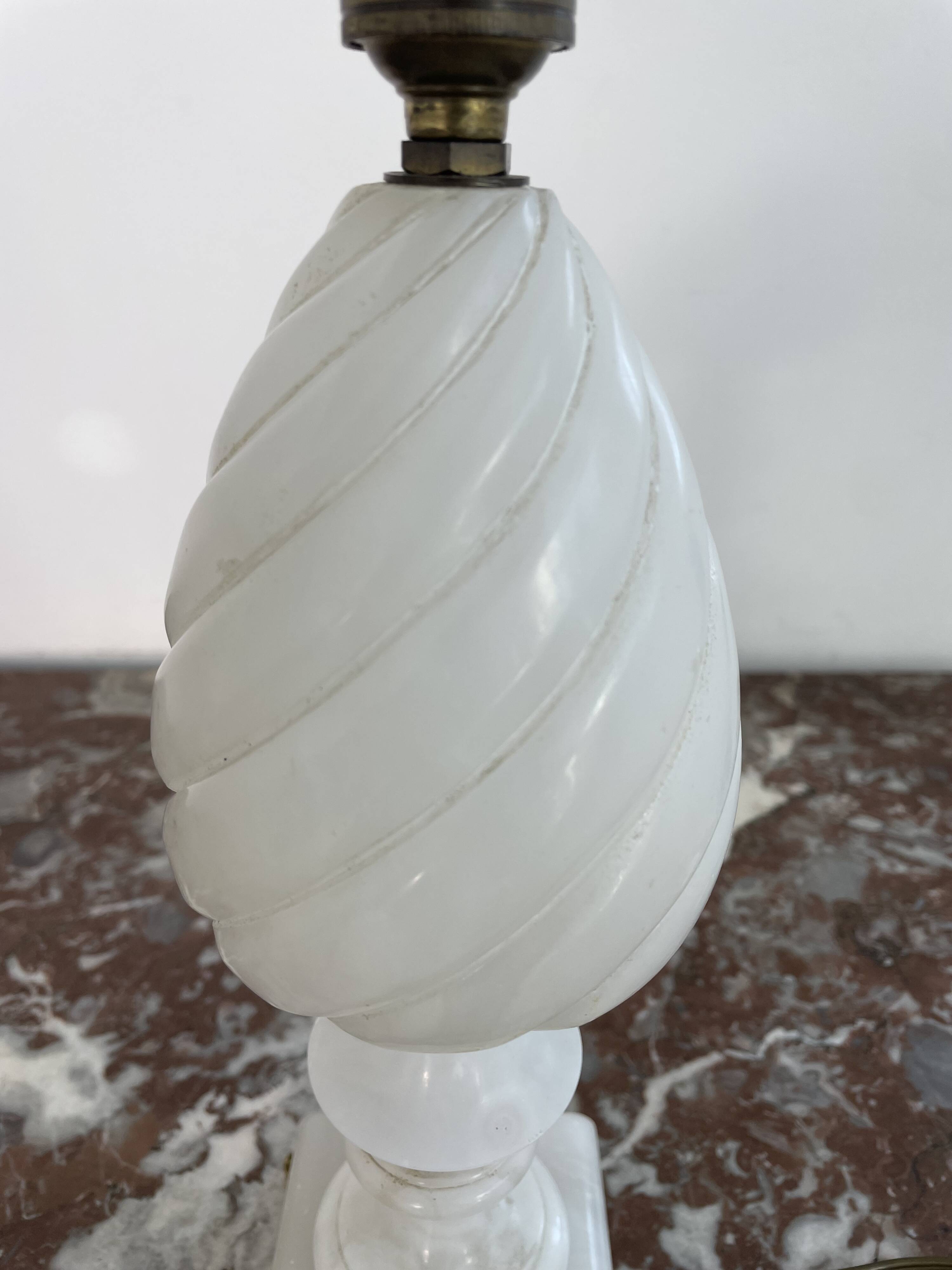 Alabaster lamp, twisted, gadroon decoration, gilded brass base, dolphins