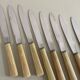 Set of 12 antique knives in green case