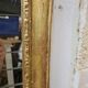 Antique gilded mirror, 19th century Empire style.