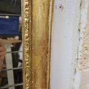 Antique gilded mirror, 19th century Empire style.