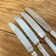 Series of 4 silver metal rocaille knives