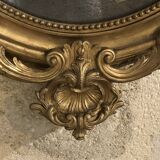 Miroir ovale doré à la feuillle