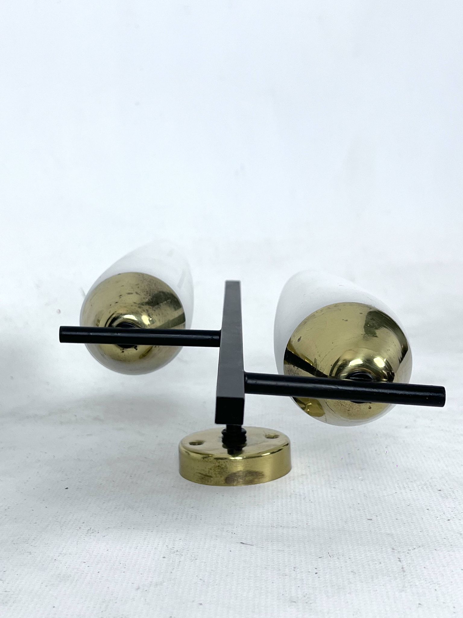 Mid-Century pair of double lights sconces in brass and opaline glass. Italy 1950s
