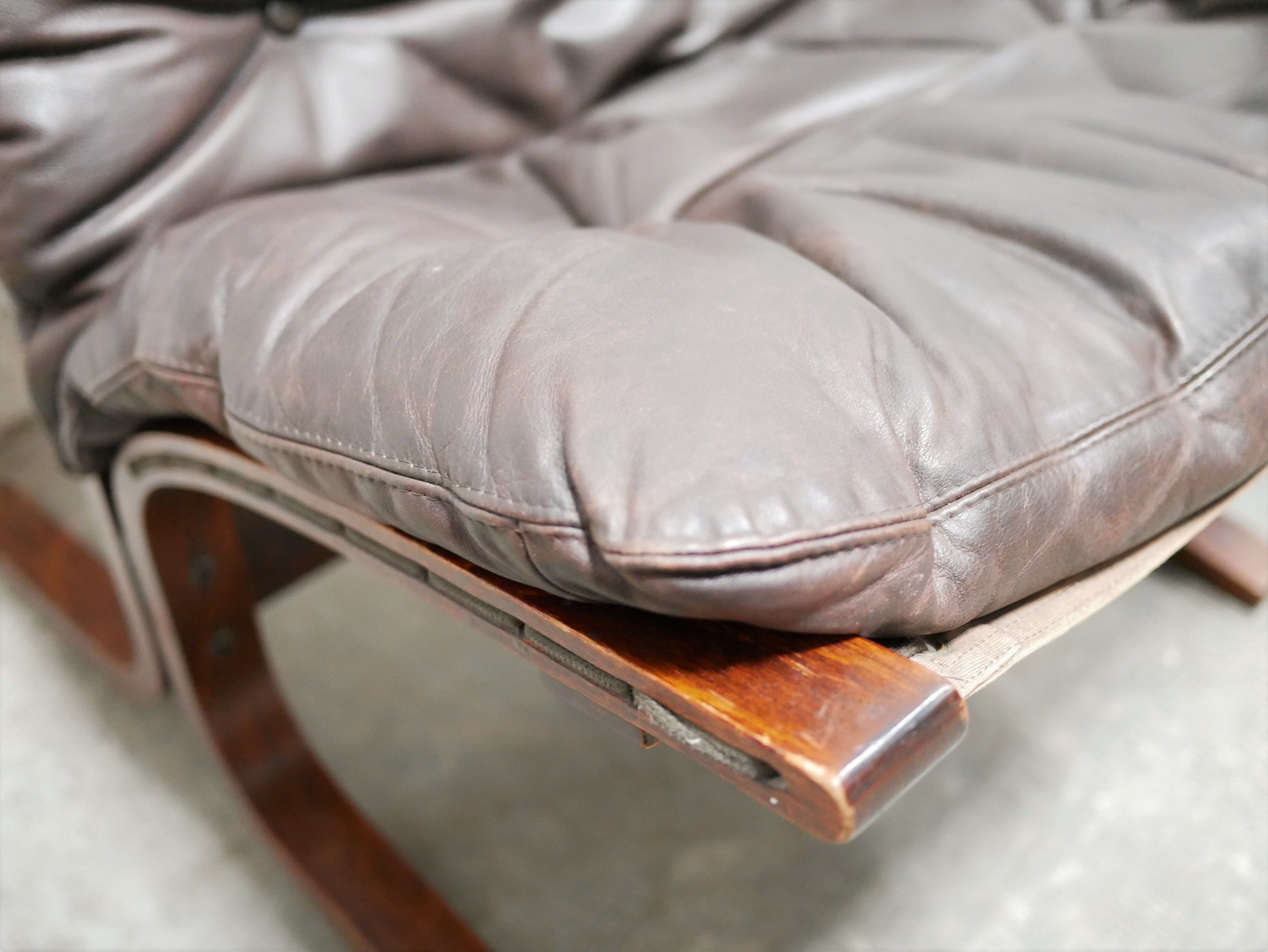 Scandinavian armchair and ottoman Siesta in brown leather by Ingmar Relling for Westnofa editions