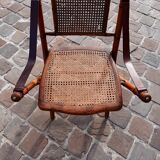Bamboo folding chair and caning, leather and brass