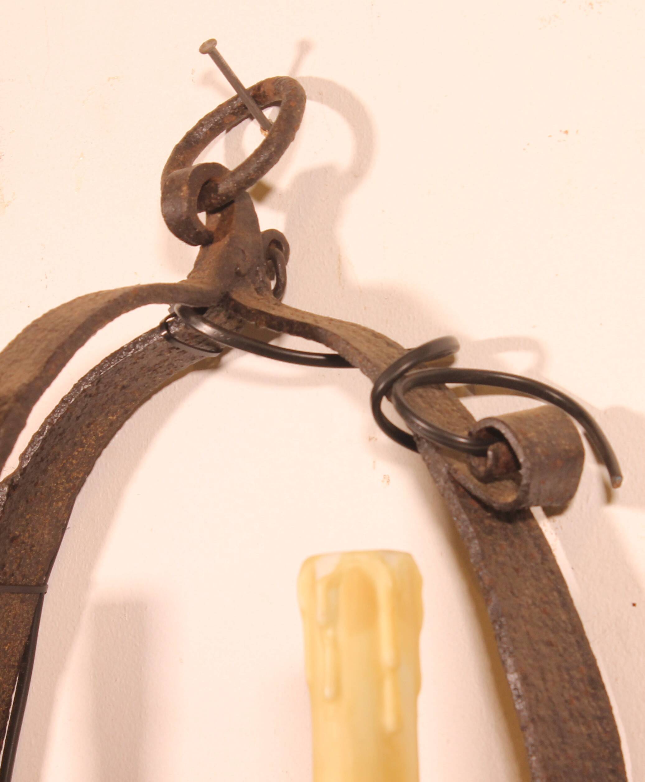 Pair of wrought iron wall sconces in medieval style