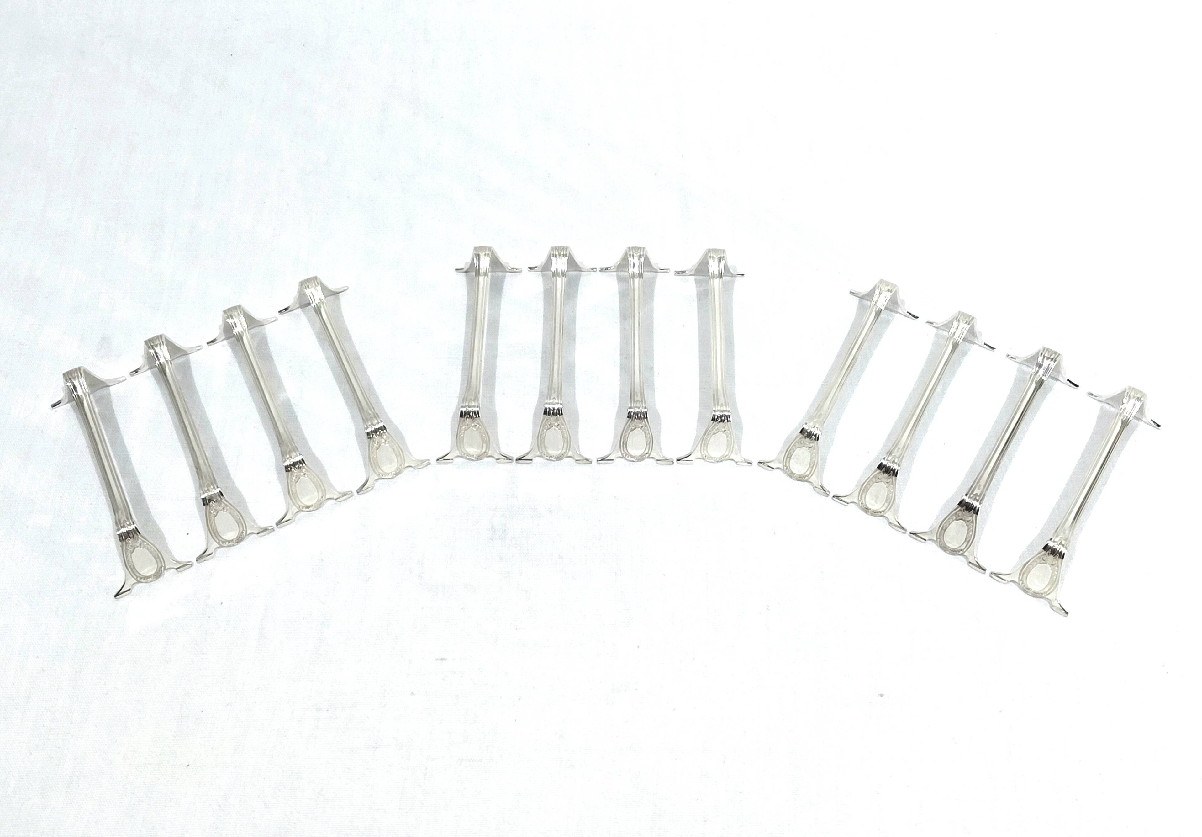 12 silver-plated metal knife rests in empire style