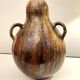 art nouveau brown 'colocynth' vase with three handles, roger guerin