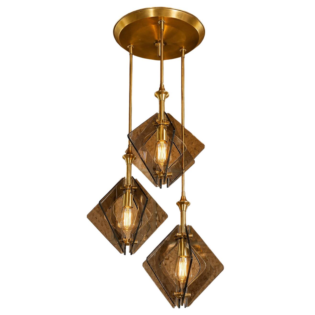 Suspension design in brass and smoked glass