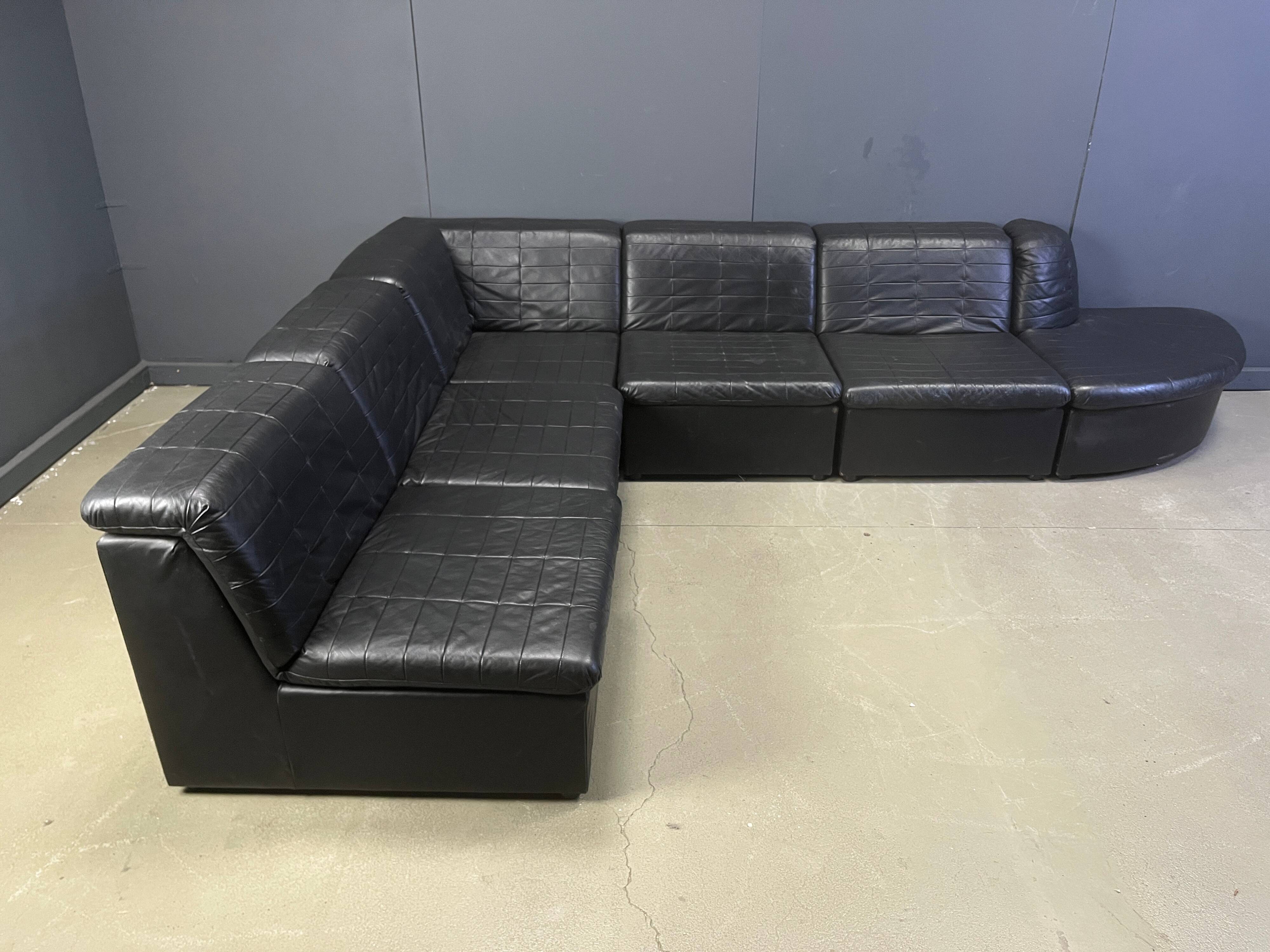 Vintage black patchwork leather modular sofa set by Laauser, 1970s