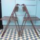 Paire de chaises pliantes en tôle perforée