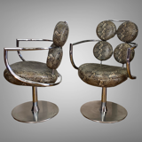 Pair of italian swivel armchairs in chrome-plated metal and piton imitation fabrics