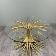 Gold metal and glass coffee table, 20th century, in the style of Robert Goos.