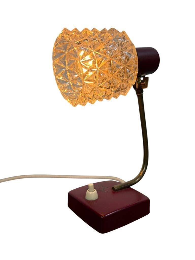 Vintage burgundy table lamp with glass shade.