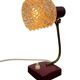 Vintage burgundy table lamp with glass shade.