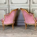 Pair of Louis XV style bergère armchairs in carved wood, pink velvet, circa 1900