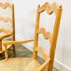 Pair of French Provencal Radassier beech chairs and ottoman, with rush seating.