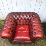 Pair of red leather chesterfield chairs
