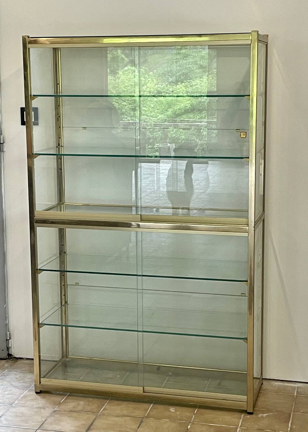 Large exhibition window in gilded brass 20th century period