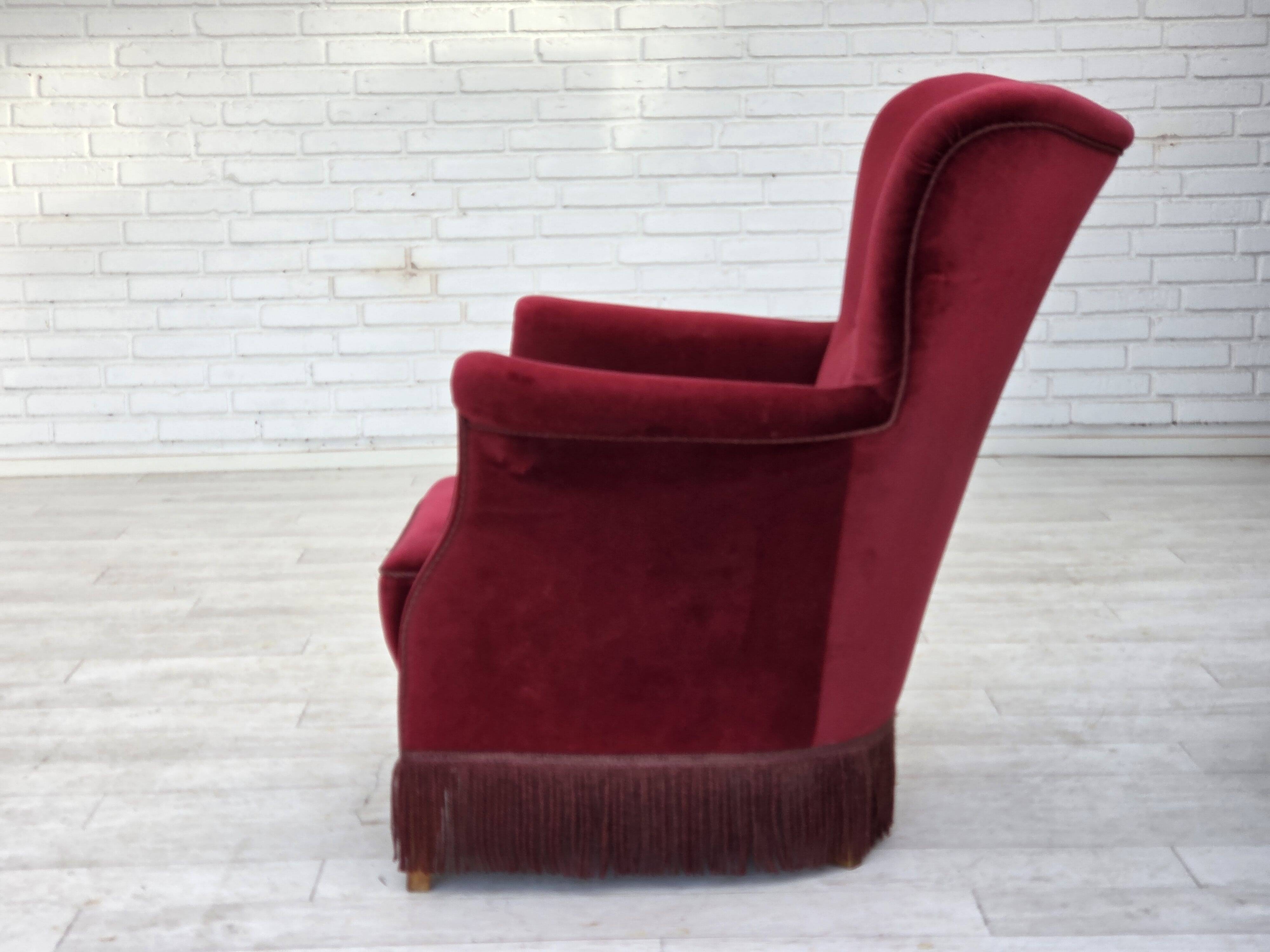 1970s, Danish armchair, cherry-red furniture velour, oak wood legs.
