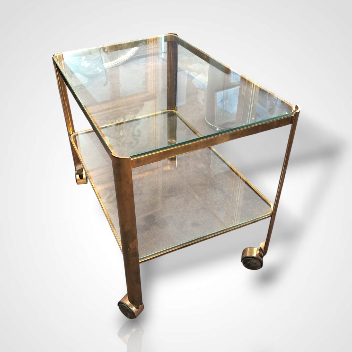 Jacques Quinet for Broncz, wheeled cart in bronze and glass, 20th century.