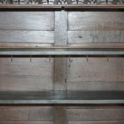 Jacobean hardwood library with carved panels and glass doors.