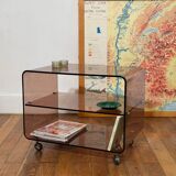 Smoked Plexiglas coffee table on wheels -