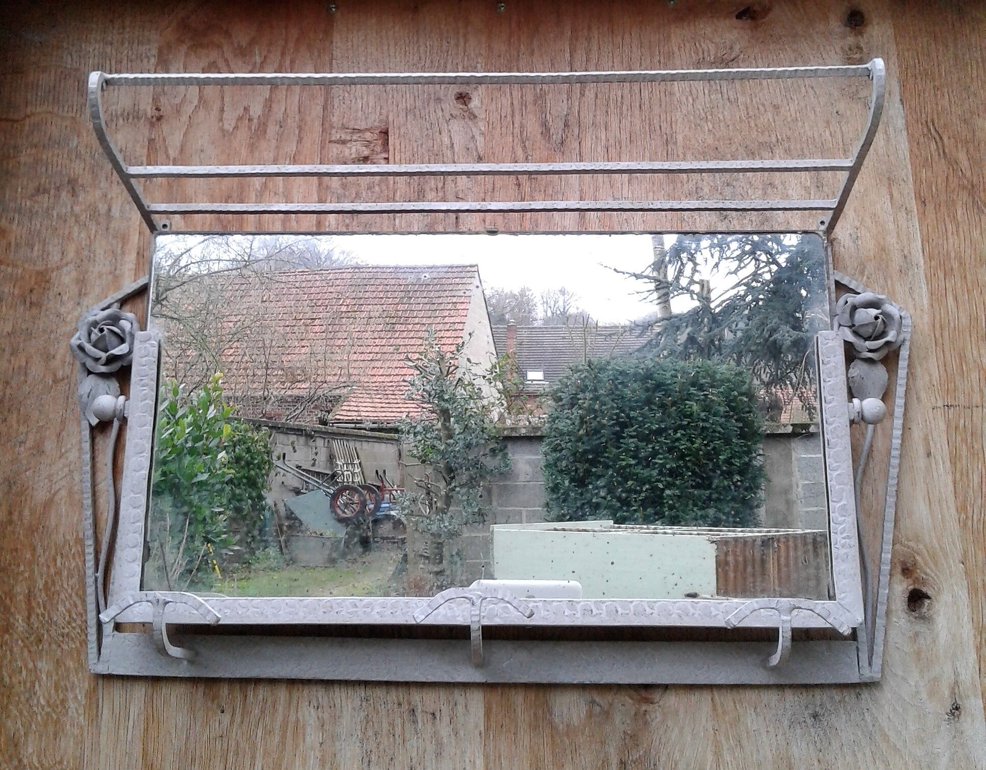 Former Wall coat hangers painted in gray iron