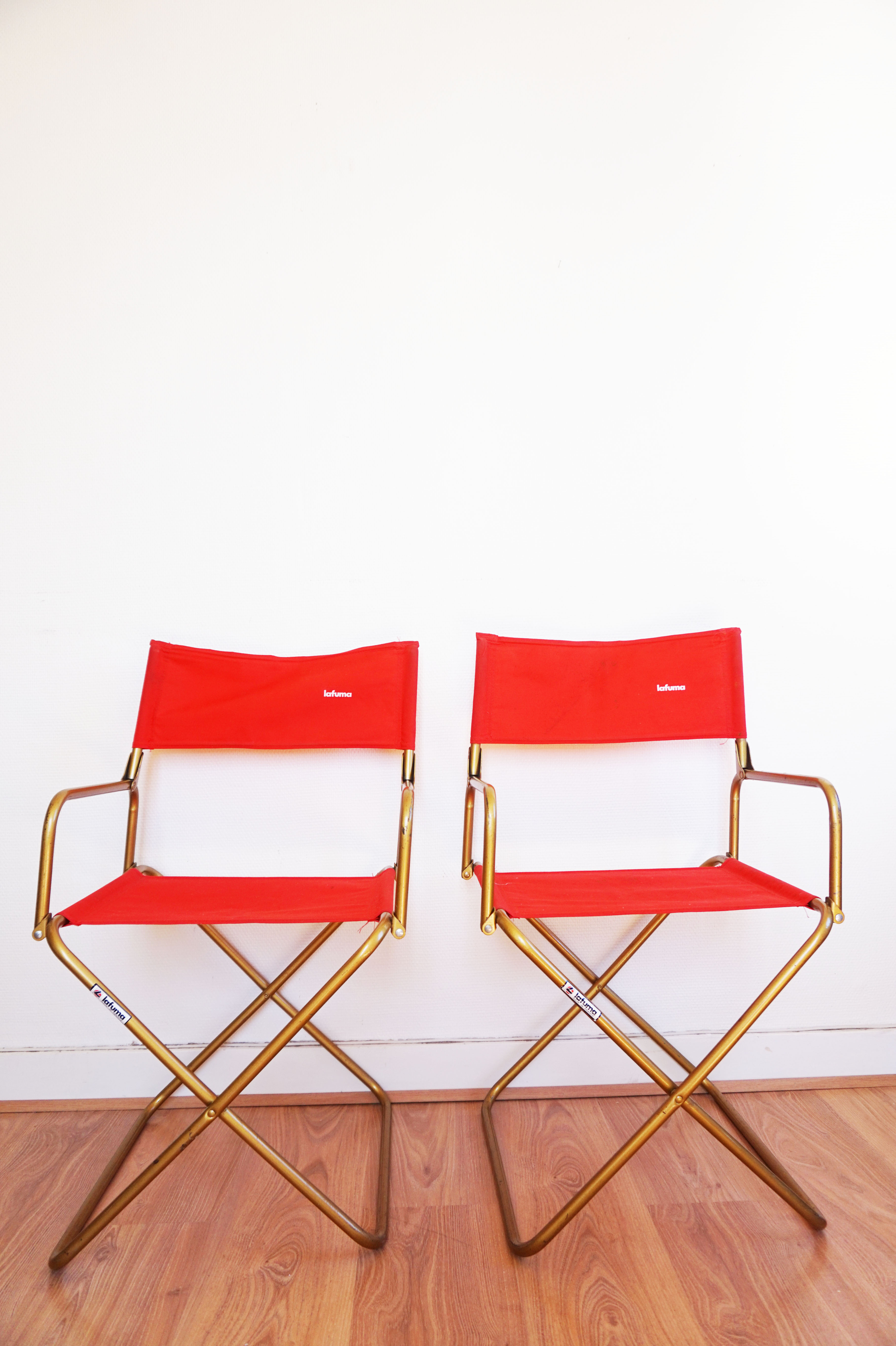 Red vintage pair of lafuma folding chairs