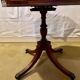 Vintage octagonal gueridon, 4 drawers, leather top, lion's paw feet.