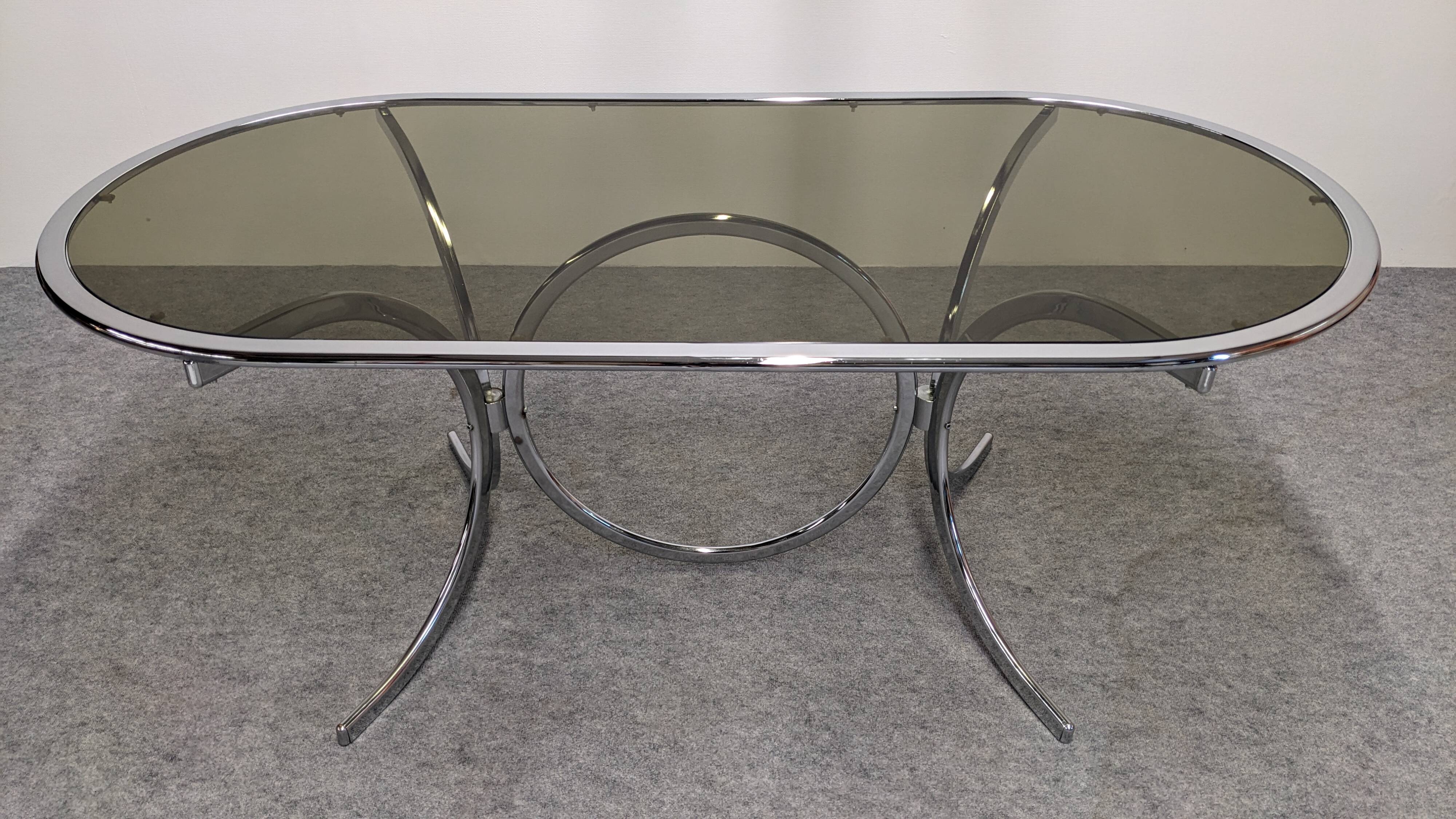 Chrome metal and smoked glass dining table, Italy circa 1970.