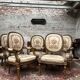 Suite de cinq fauteuils à dossier médaillon de style Louis XVI
