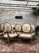 Suite de cinq fauteuils à dossier médaillon de style Louis XVI