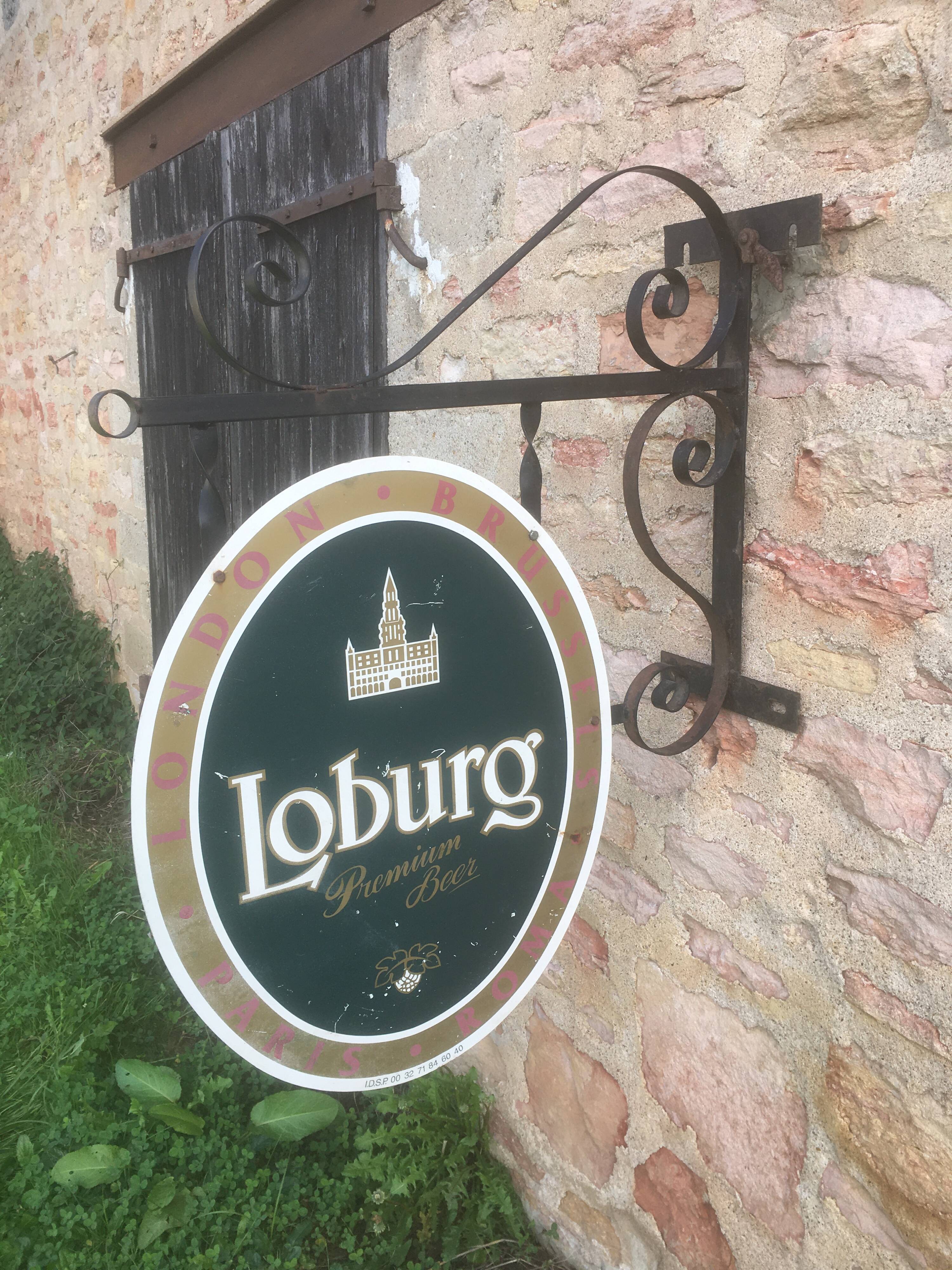 Double-sided "Loburg Beer" metal sign on wrought iron bracket